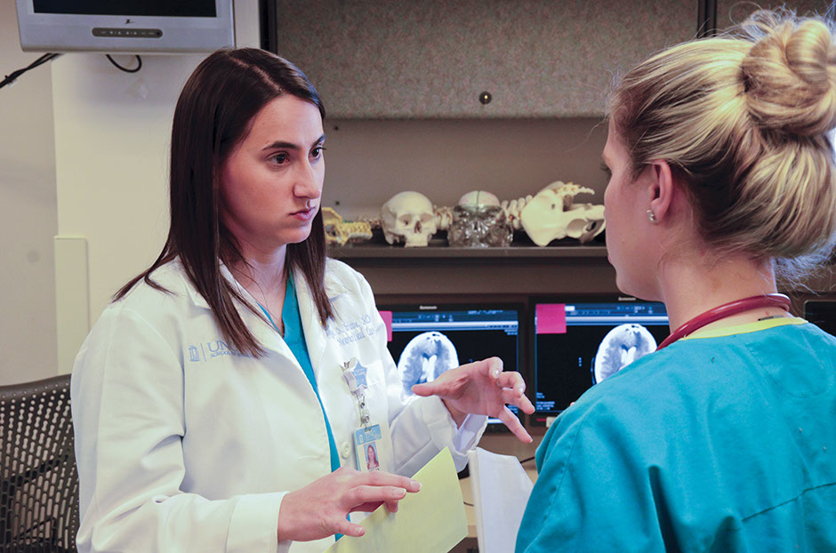 Megan Brissie’s teaches residents and medical and nurse practitioner students like Ashley Sprouse in the UNC Hospitals Neuroscience Intensive Care Unit.