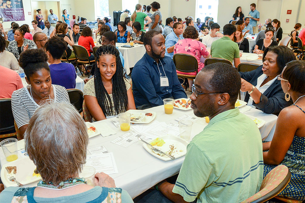 Taffye Benson Clayton (far right), associate vice chancellor for Diversity and Multicultural Affairs and the University’s chief diversity officer, talks with attendees at the Diversity and Student Success program event.