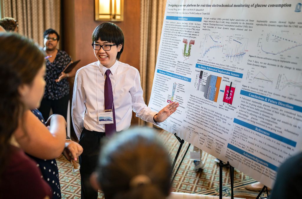 A student presents his research at the Summer Undergraduate Pipeline Research Symposium